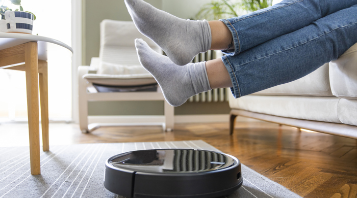 A robot vacumm cleaning a rug