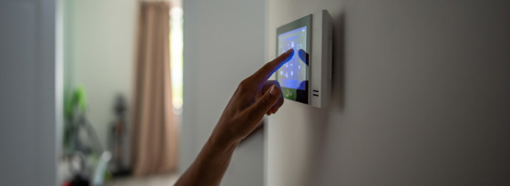 Hand Touching A Smart Home Controller