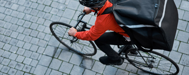 Delivery Person Cycling Through City Streets 2026 09 24 13 08 45 Utc