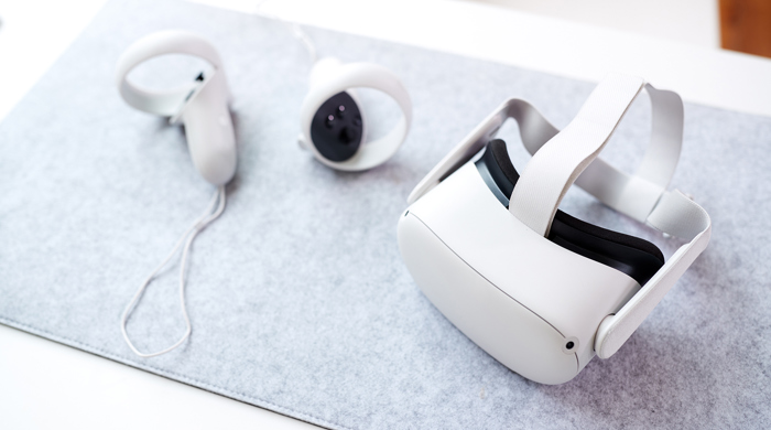 VR headset and controllers on a deskmat